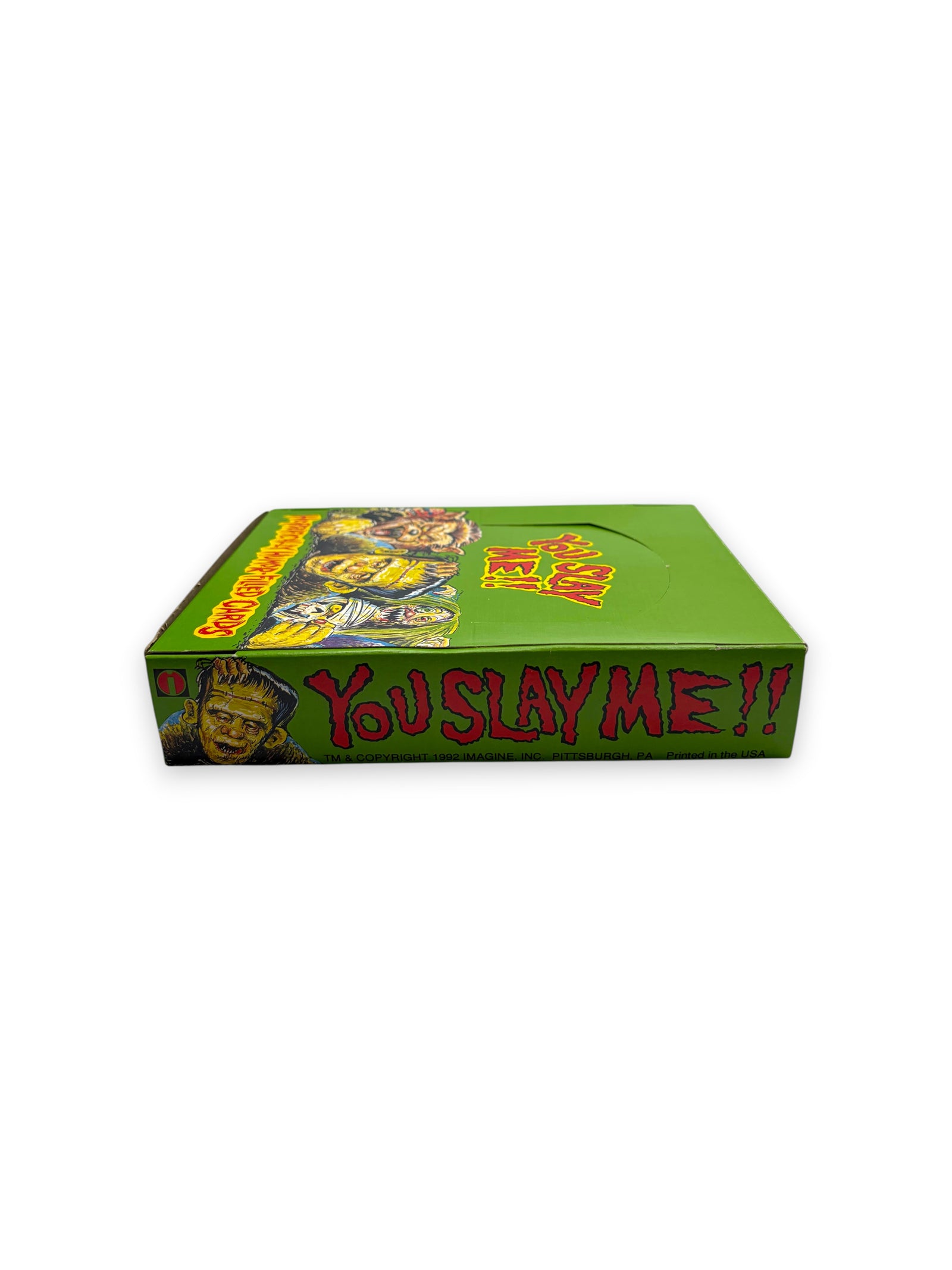 Lowkey Stock 1992 You Slay Me trading card display box featuring green packaging and classic monster illustrations.