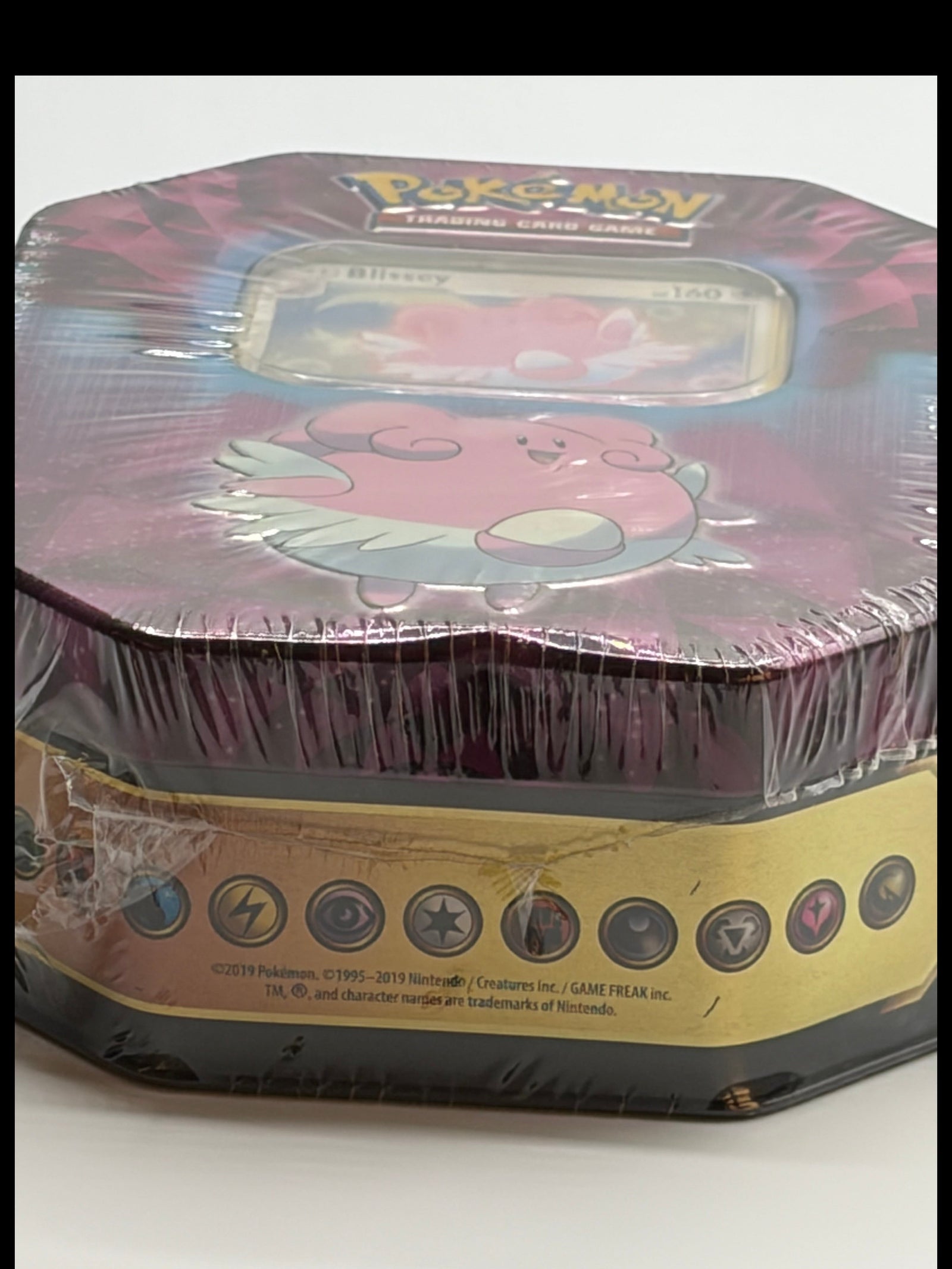 Lowkey Stock Pokemon TCG Blissey Strong Bond collector tin featuring pink Blissey artwork, factory sealed in plastic.