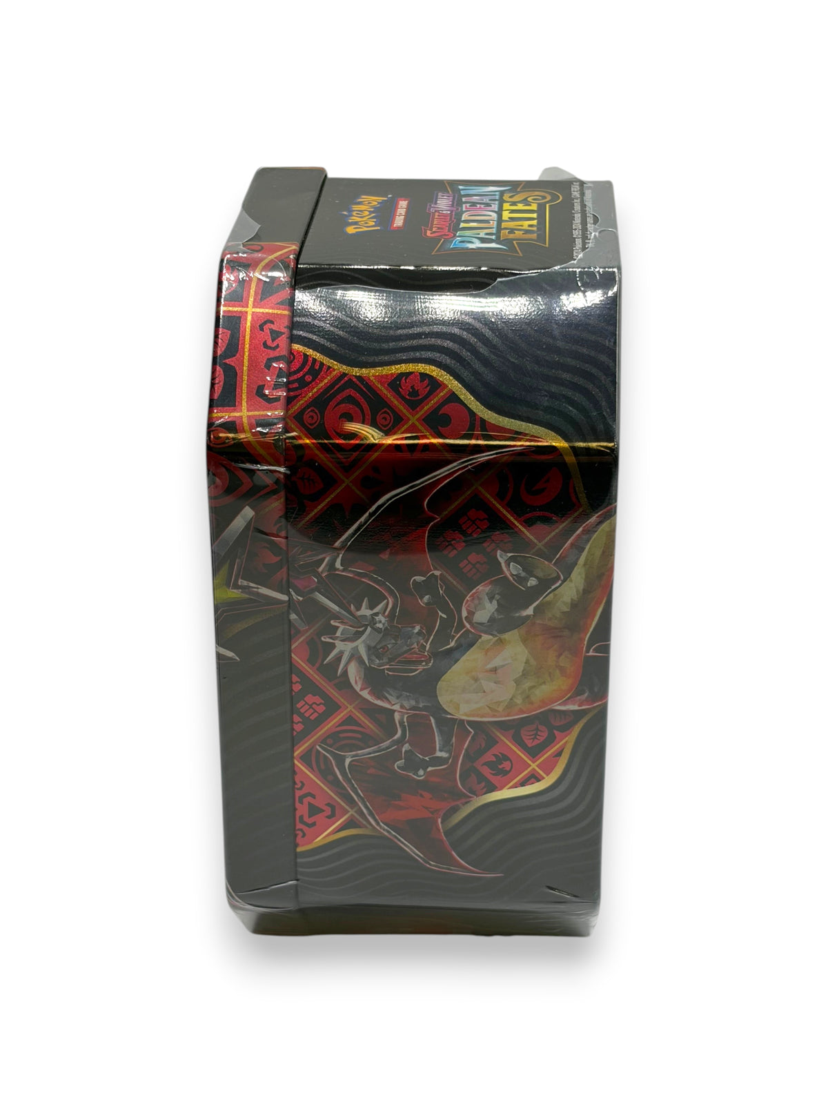 Lowkey Stock Pokemon Paldean Fates Charizard ex tin with black and red dragon artwork, showing minor seal tears