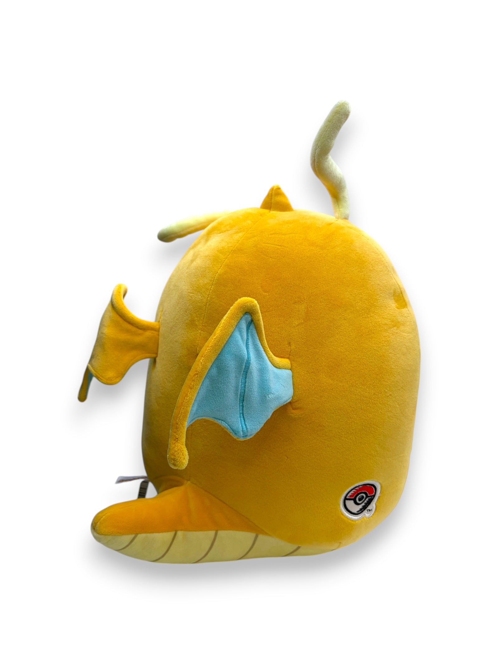 Lowkey Stock 14-inch Dragonite plush toy with ultrasoft yellow fabric, blue wings, and a Poké Ball logo detail.