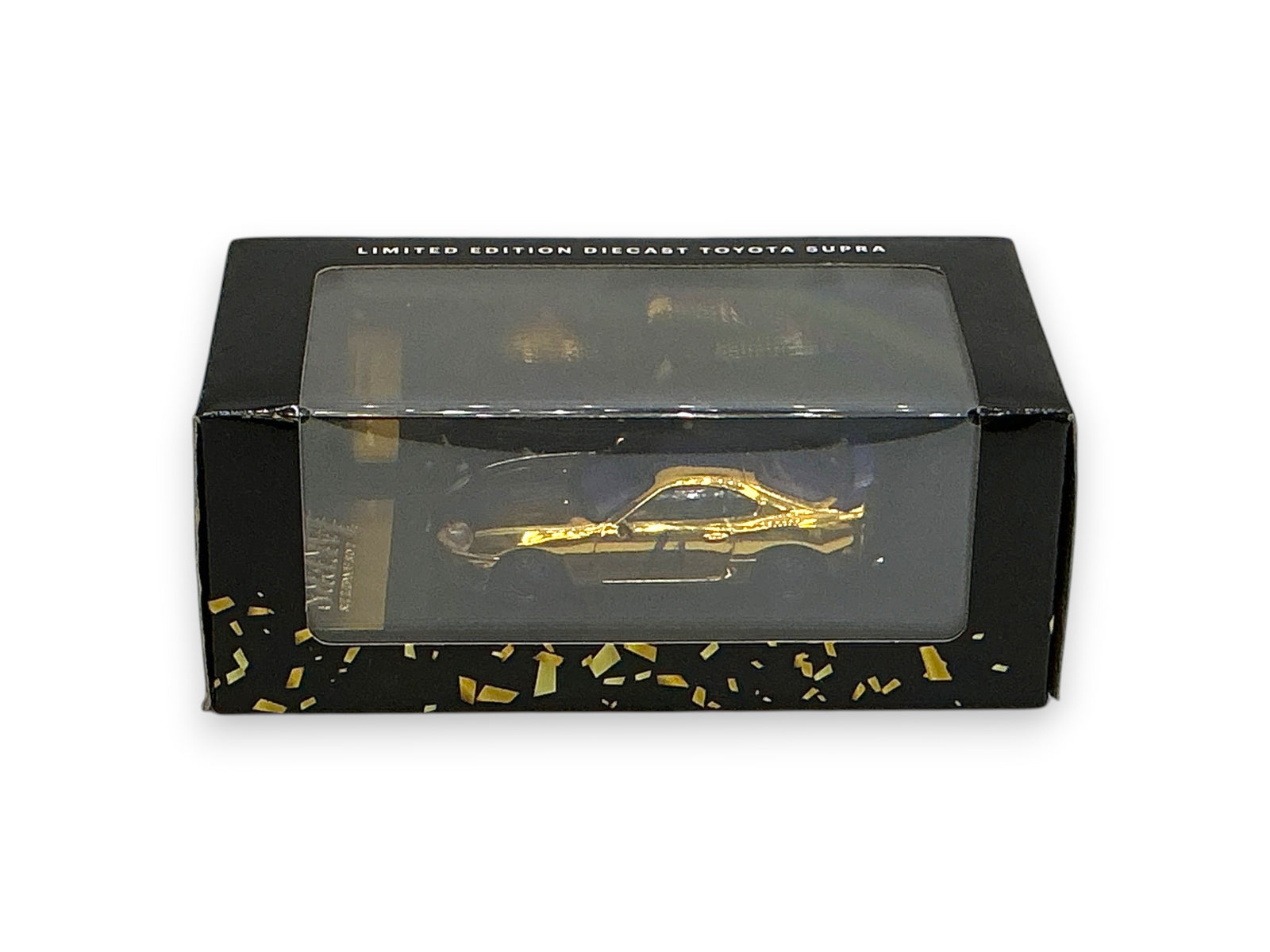 Lowkey Stock limited edition gold diecast Toyota Supra collectible car inside a black display box with confetti design