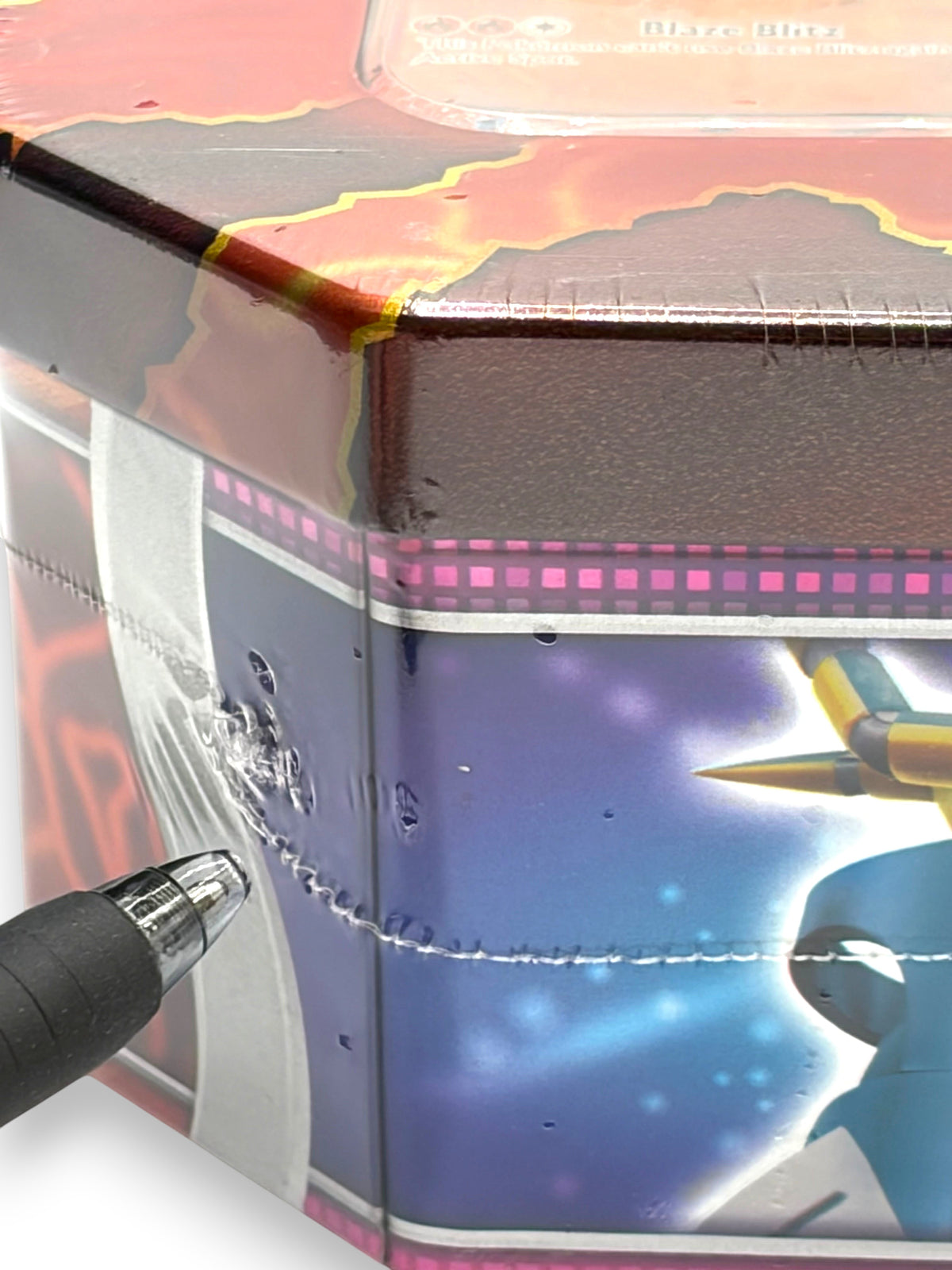 Lowkey Stock Pokemon Paradox Destinies Gouging Fire ex tin showing a small tear in the factory plastic shrink wrap