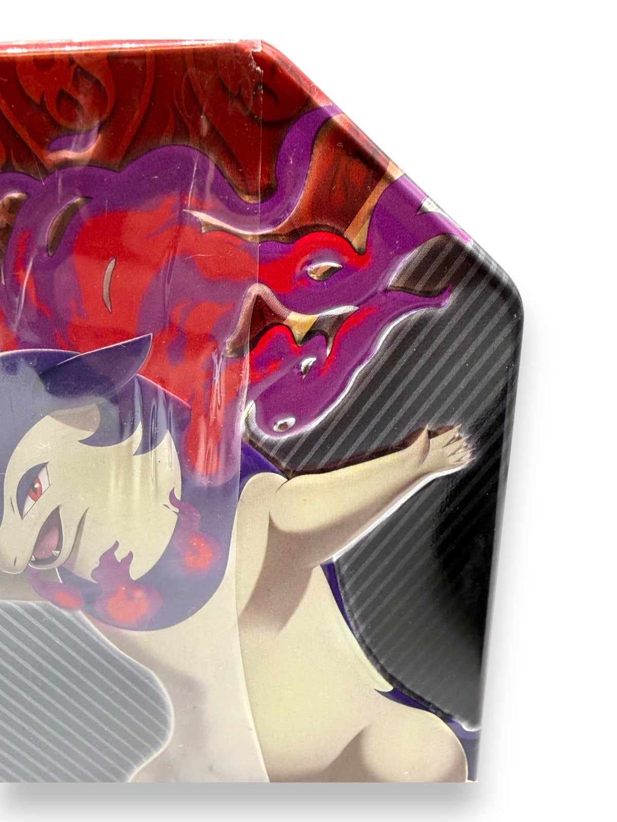 Lowkey Stock Pokemon Divergent Powers Hisuian Typhlosion V tin featuring purple and red flames on a black background