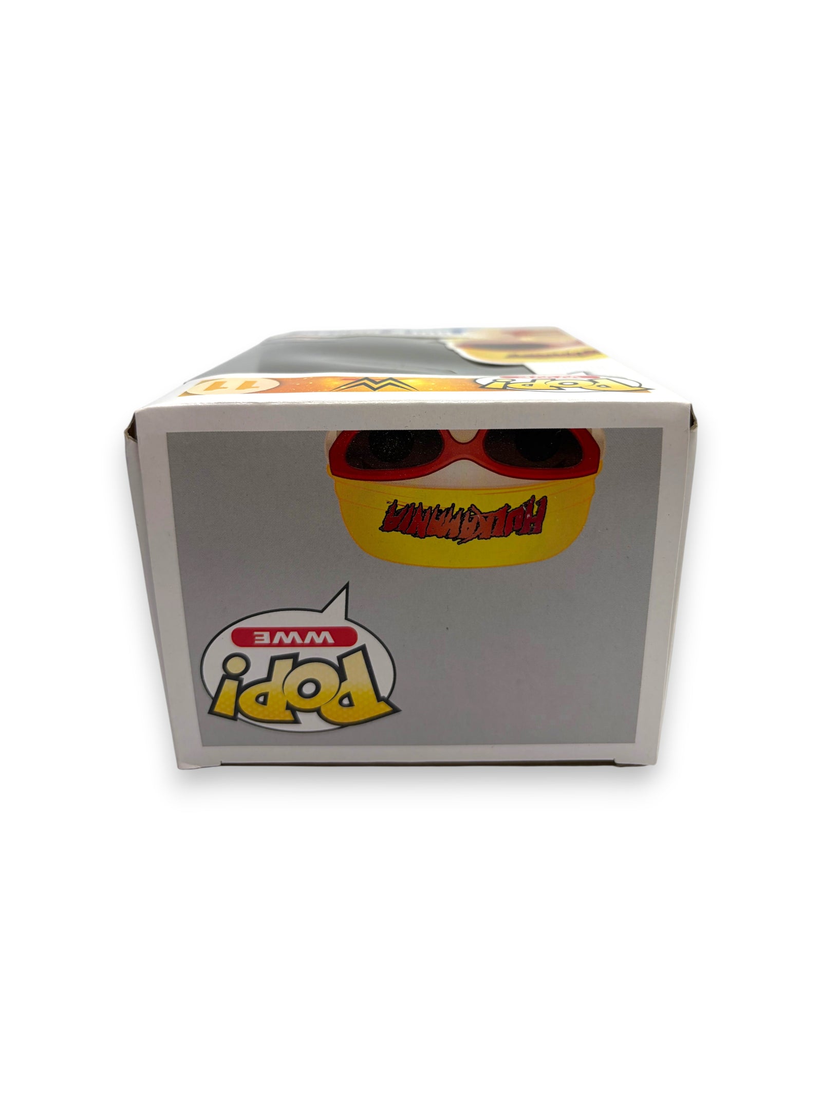 Lowkey Stock Funko Pop WWE Hulk Hogan figure box side view featuring Hulkamania logo and red sunglasses graphic