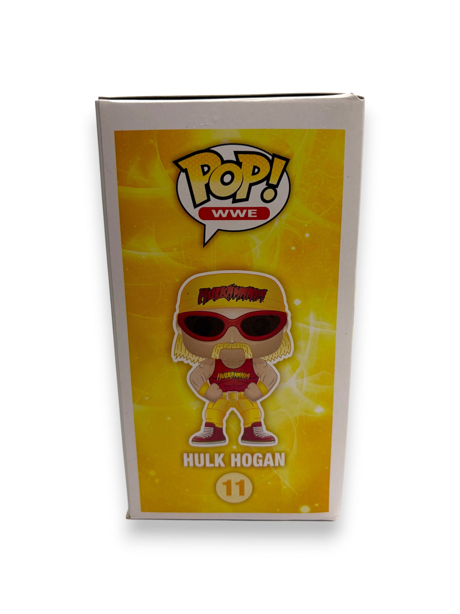 Lowkey Stock Funko Pop WWE Hulk Hogan figure box featuring yellow background and Hulkamania branding