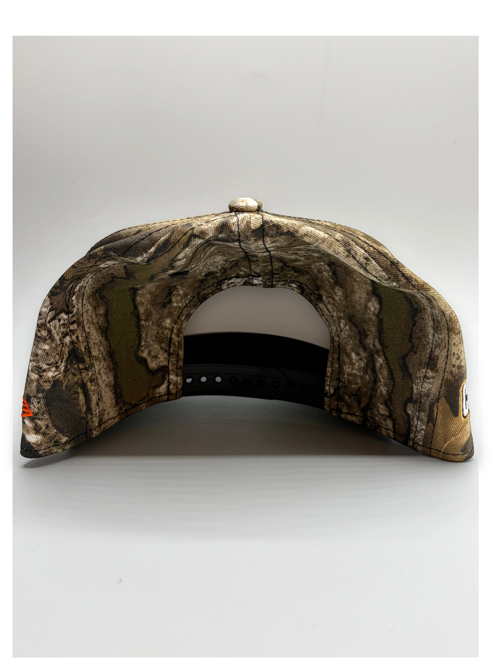 Lowkey Stock New York Knicks 9FIFTY camo snapback cap with 2026 Champions side patch, rear view