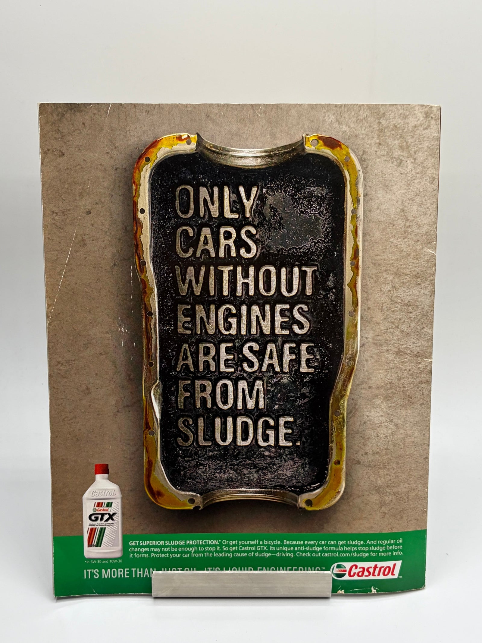 Lowkey Stock metal sign featuring the text Only Cars Without Engines Are Safe From Sludge with a distressed finish
