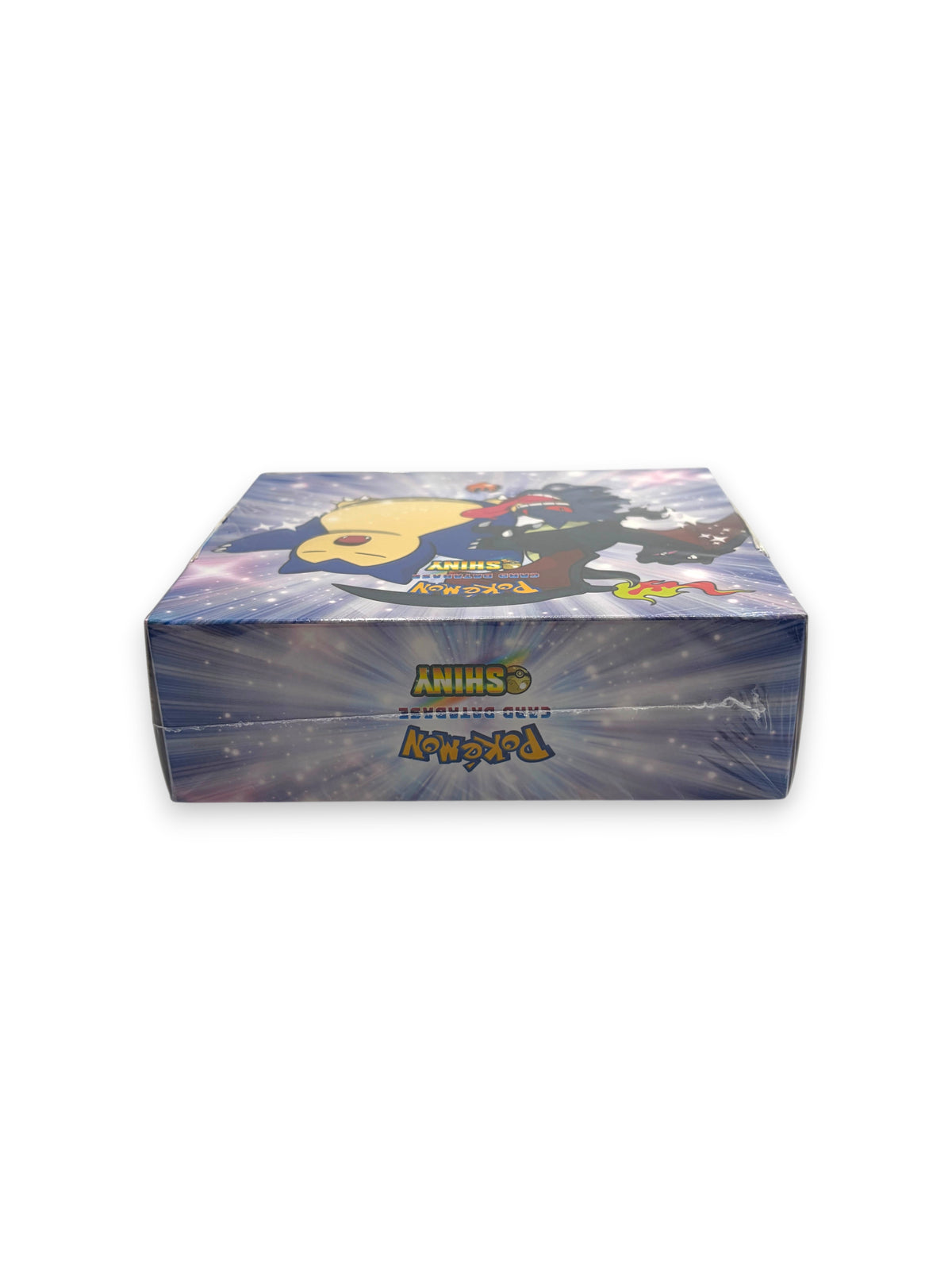 Lowkey Stock UNLICENSED Pokémon Card Database Shiny booster box featuring Snorlax artwork in a sealed display case.