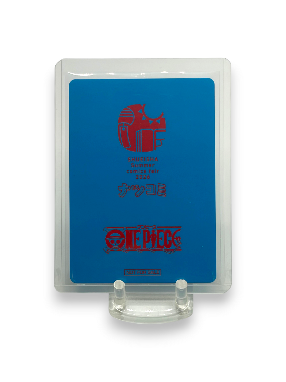 Lowkey Stock 2026 Shueisha NatsuComi MetaKira promotional card featuring One Piece branding in a protective case