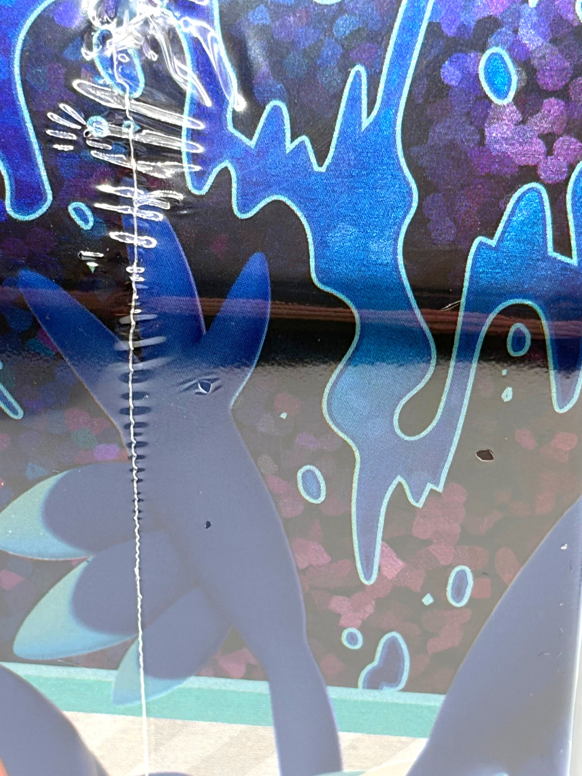Lowkey Stock Pokemon TCG Paldea Partners Skeledirge EX tin featuring blue and purple holographic artwork
