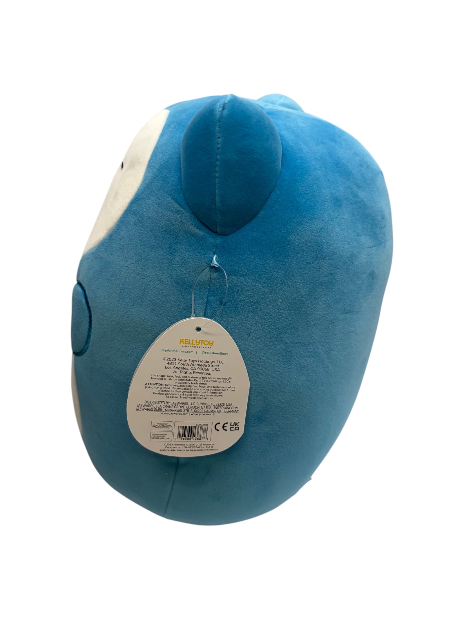 Lowkey Stock Pokémon Center Snorlax Squishmallows plush toy with blue fabric and attached product tag