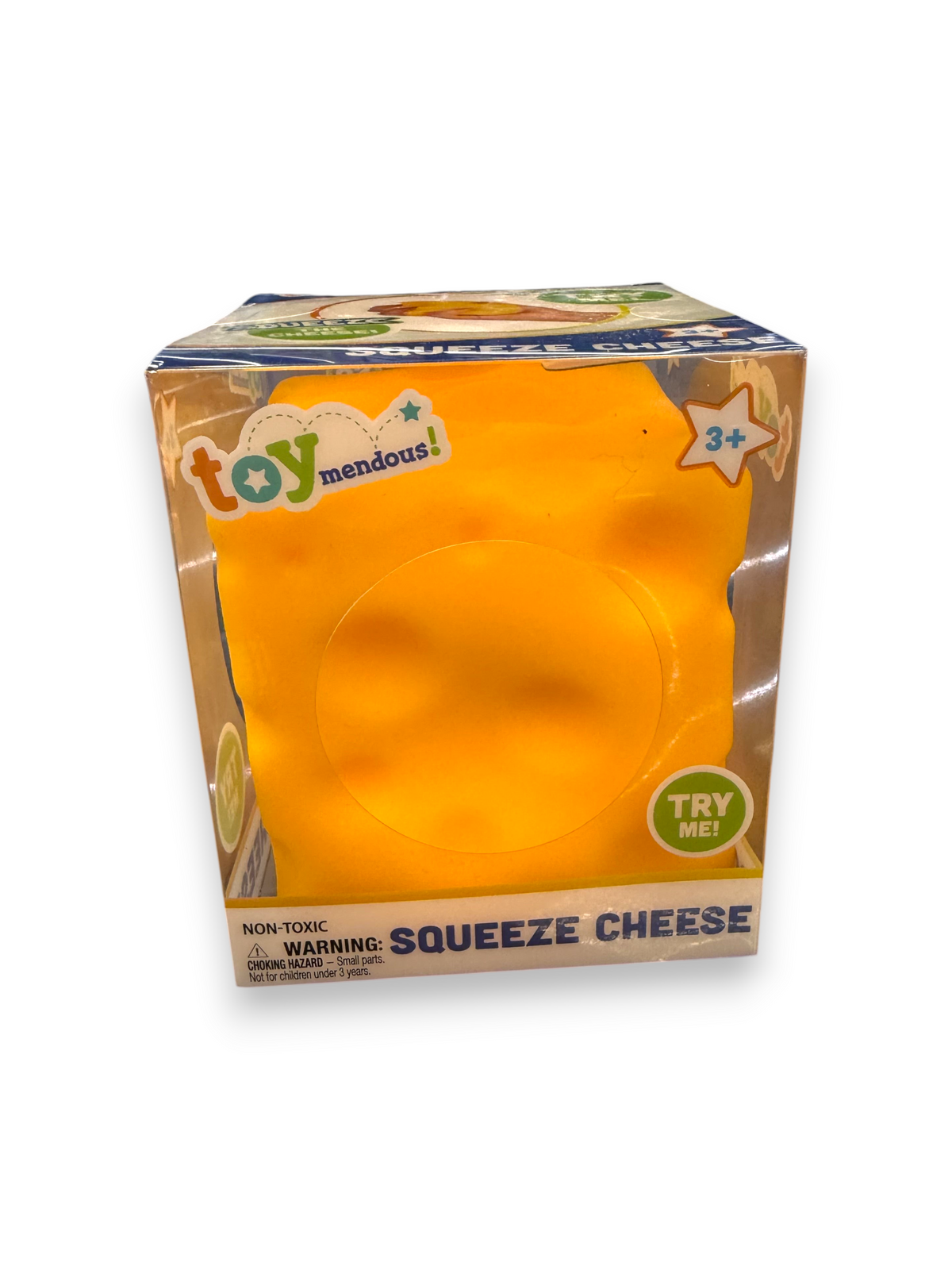 Lowkey Stock Squishy Squeeze Cheese yellow sensory toy in clear display packaging on a black counter