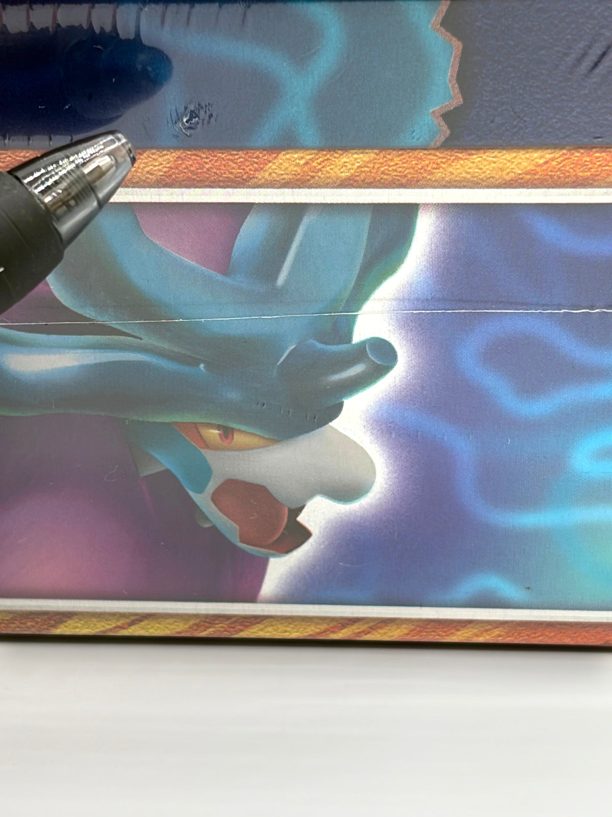 Lowkey Stock Pokemon Paradox Clash Walking Wake ex tin featuring blue and purple artwork with a visible surface scratch