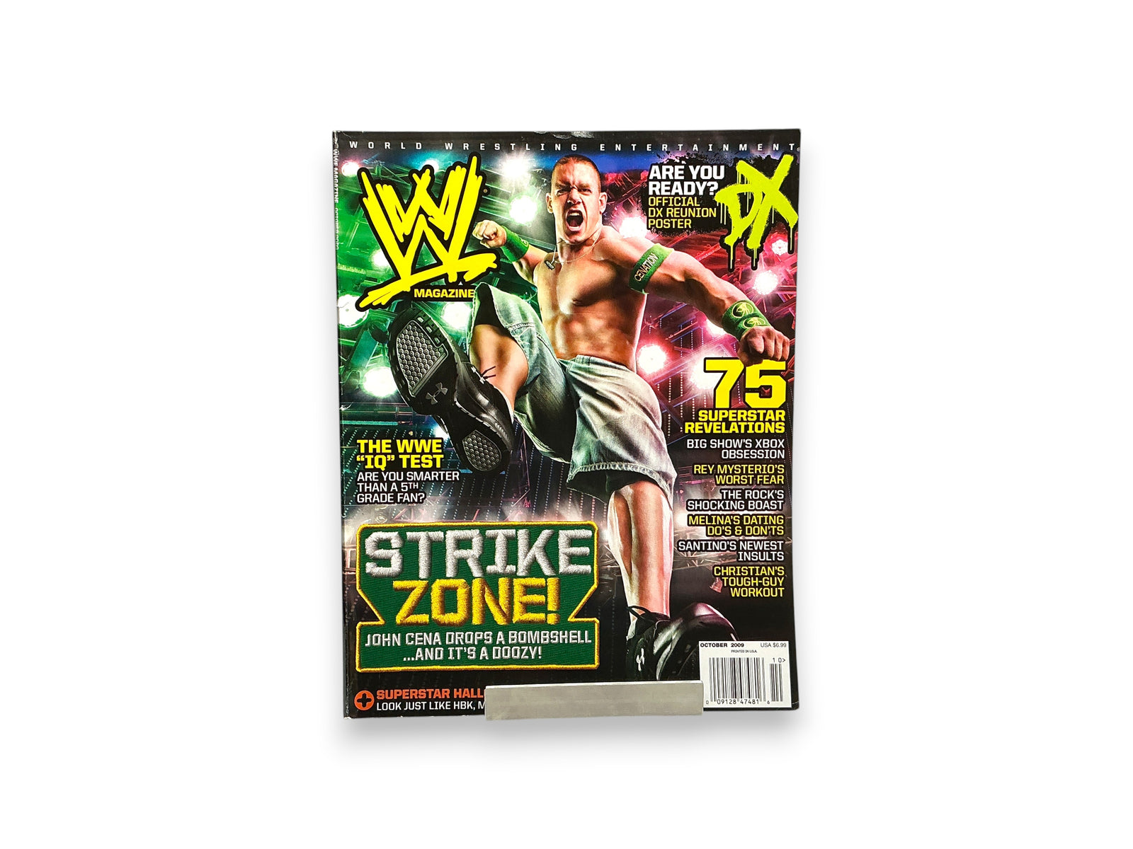 Lowkey Stock WWE Magazine October 2009 featuring John Cena on the cover with bright stage lighting background
