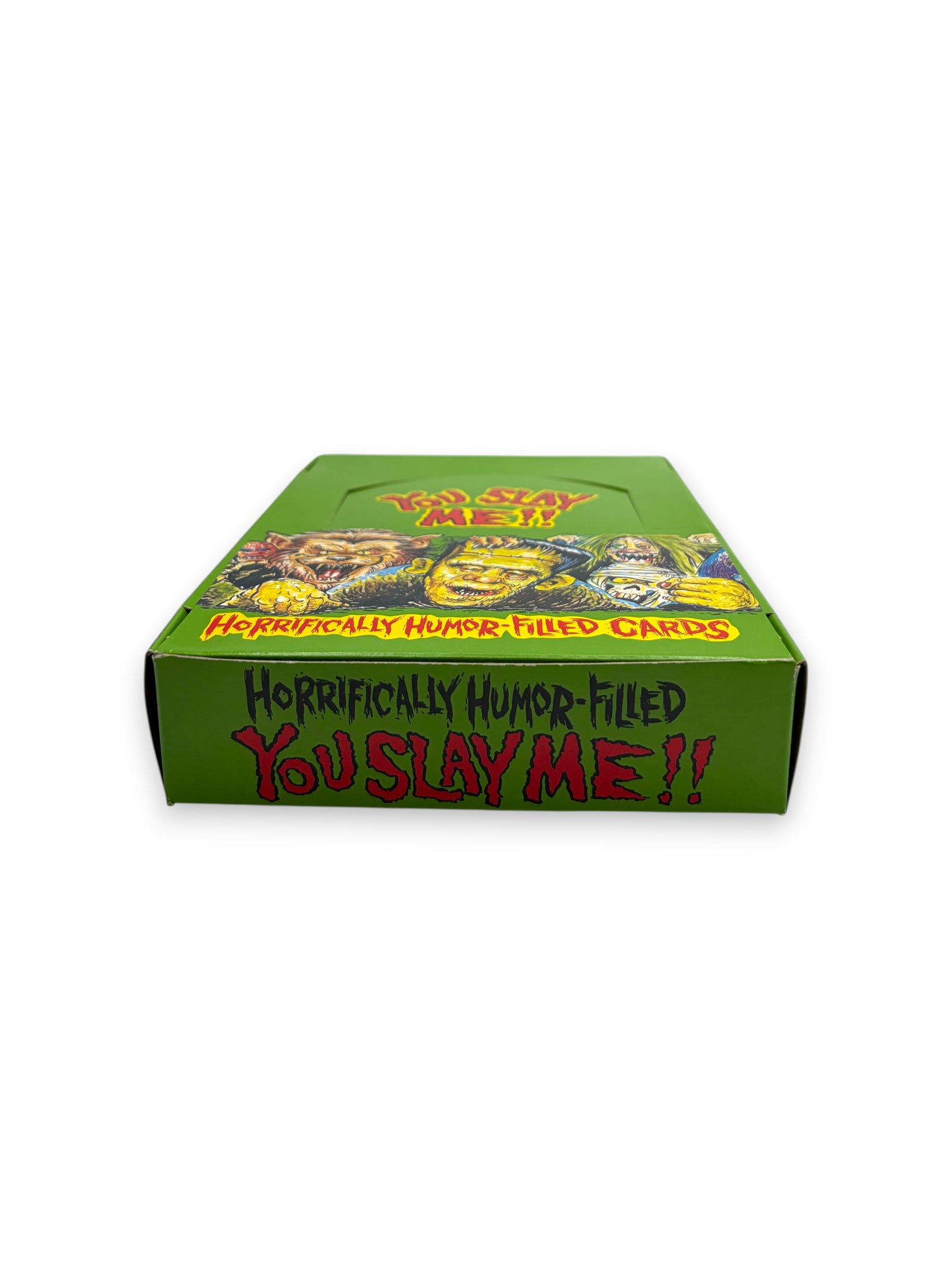 Lowkey Stock 1992 You Slay Me trading card display box featuring green packaging and vintage horror-themed illustrations